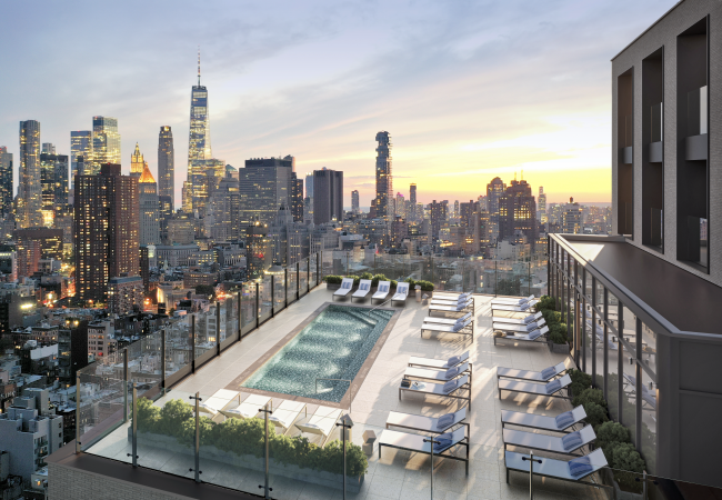 rooftop pool and loungers with NYC buildings to horizon
